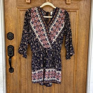 ee:some | bell sleeve romper w/ large slit in back